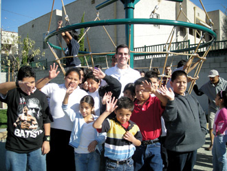 Garcetti surrounded by children at the 2007 opening of Seily Rodriguez Park, the 20th park created in his district since he took office. Photo: Courtesy Eric Garcetti ’92, ’93 SIPA